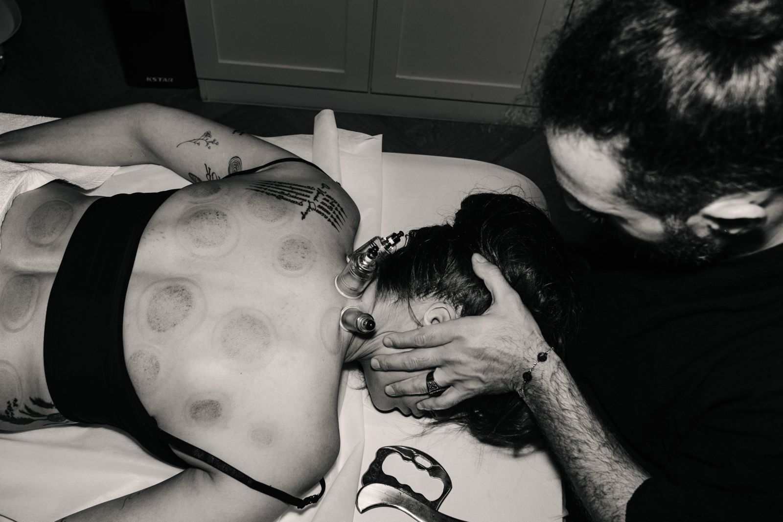 Nad Marwani using cupping and neck release for desk-related back pain in Bangkok