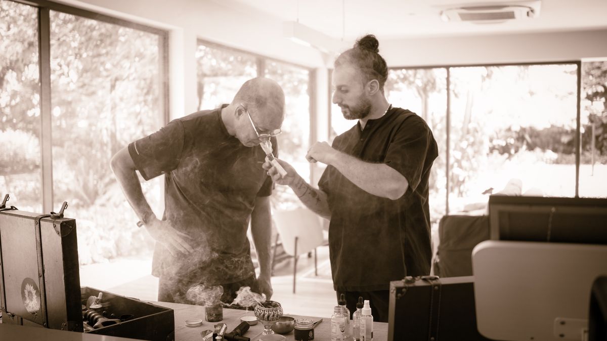 Nad guiding a client through a ritual with incense